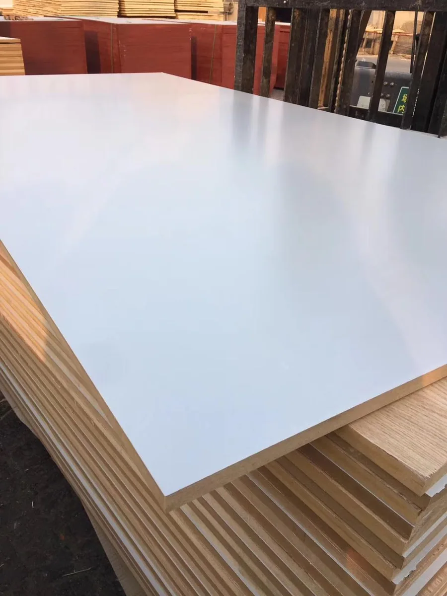 White melamine MDF sheets showing the smooth face and fibreboard edges